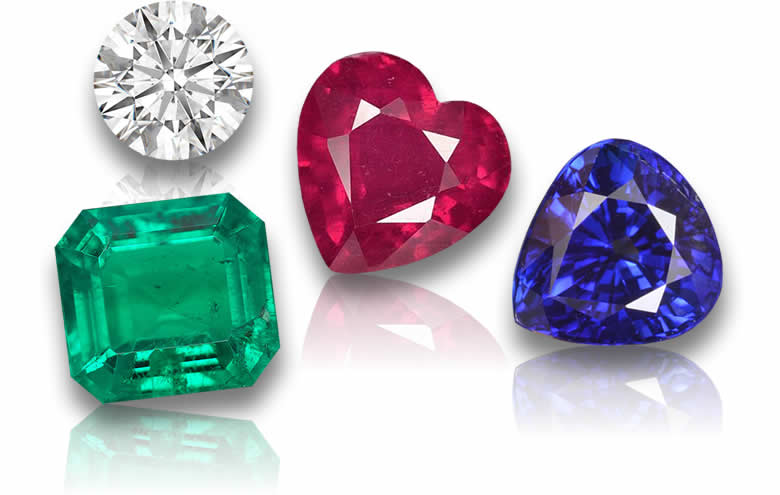 Piedras preciosas sueltas, incluyendo rubí, zafiro, esmeralda y diamante.