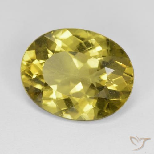 Apatito Amarillo amarronado natural de 7.06 ct, Ovalada, VS