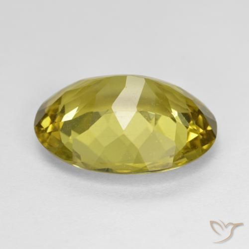 Apatito Amarillo amarronado natural de 7.06 ct, Ovalada, VS