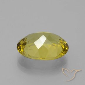 Apatito Amarillo amarronado natural de 6.66 ct, Ovalada, VS