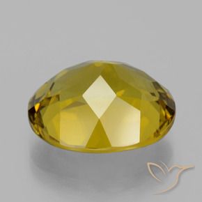 Apatito Amarillo amarronado natural de 13.86 ct, Ovalada, VS