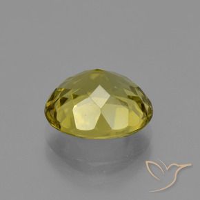 Apatito Amarillo amarronado natural de 3.43 ct, Ovalada, VS