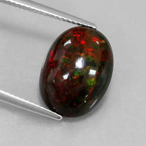 Ópalo negro multicolor natural de 4,33 ct, corte óvalo, opaco