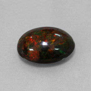 Ópalo negro multicolor natural de 4,33 ct, corte óvalo, opaco