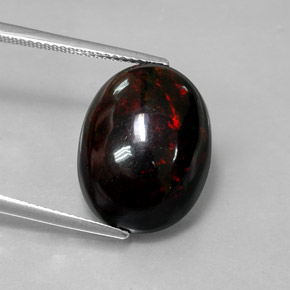 Ópalo negro multicolor natural de 8,82 ct, corte óvalo, opaco