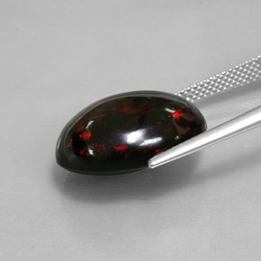 Ópalo negro multicolor natural de 8,82 ct, corte óvalo, opaco