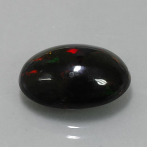 Ópalo negro multicolor natural de 4,34 ct, corte óvalo, opaco