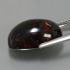 Ópalo negro multicolor natural de 5,81 ct, corte óvalo, opaco