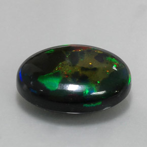 Ópalo negro multicolor natural de 6,36 ct, corte óvalo, opaco