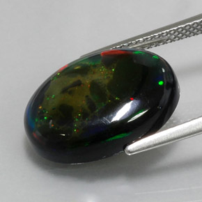 Ópalo negro multicolor natural de 6,36 ct, corte óvalo, opaco
