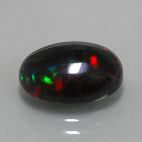 Ópalo negro multicolor natural de 2,83 ct, corte óvalo, opaco