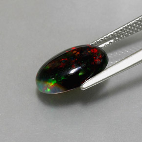 Ópalo negro multicolor natural de 2,26 ct, corte óvalo, opaco