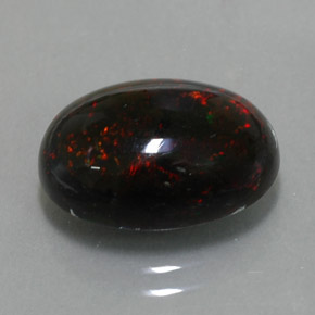 Ópalo negro multicolor natural de 3,63 ct, corte óvalo, opaco