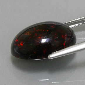 Ópalo negro multicolor natural de 3,63 ct, corte óvalo, opaco