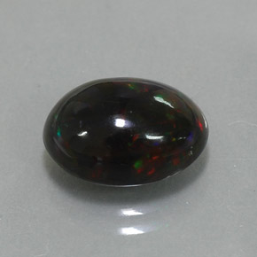 Ópalo negro multicolor natural de 2,73 ct, corte óvalo, opaco