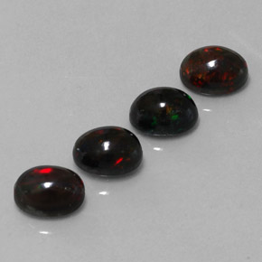 Gemas de ópalo negro multicolor natural de  ct, corte óvalo, opaco