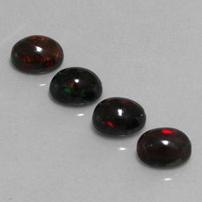 Gemas de ópalo negro multicolor natural de  ct, corte óvalo, opaco
