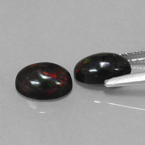 Gemas de ópalo negro multicolor natural de  ct, corte óvalo, opaco