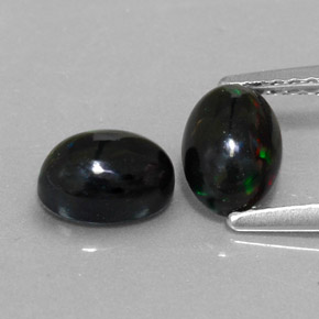 Gemas de ópalo negro multicolor natural de  ct, corte óvalo, opaco