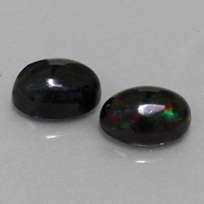 Gemas de ópalo negro multicolor natural de  ct, corte óvalo, opaco