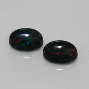 Gemas de ópalo negro multicolor natural de  ct, corte óvalo, opaco
