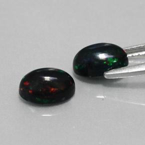Gemas de ópalo negro multicolor natural de  ct, corte óvalo, opaco