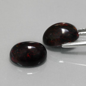 Gemas de ópalo negro multicolor natural de  ct, corte óvalo, opaco