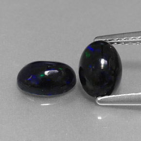 Gemas de ópalo negro multicolor natural de  ct, corte óvalo, opaco