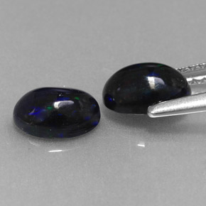 Gemas de ópalo negro multicolor natural de  ct, corte óvalo, opaco
