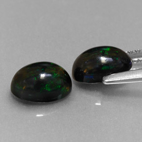 Gemas de ópalo negro multicolor natural de  ct, corte óvalo, opaco