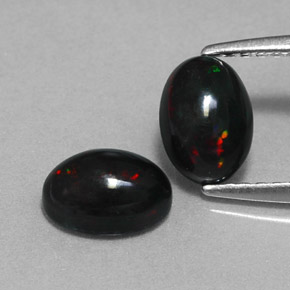 Gemas de ópalo negro multicolor natural de  ct, corte óvalo, opaco