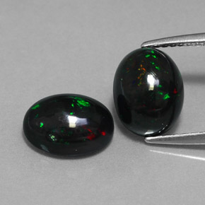 Gemas de ópalo negro multicolor natural de  ct, corte óvalo, opaco