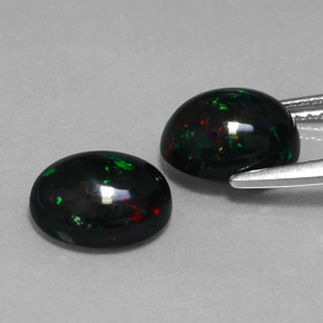 Gemas de ópalo negro multicolor natural de  ct, corte óvalo, opaco