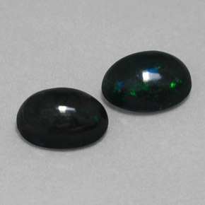 Gemas de ópalo negro multicolor natural de  ct, corte óvalo, opaco