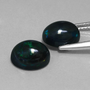 Gemas de ópalo negro multicolor natural de  ct, corte óvalo, opaco