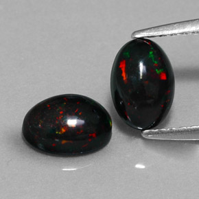 Gemas de ópalo negro multicolor natural de  ct, corte óvalo, opaco