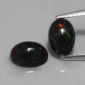 Gemas de ópalo negro multicolor natural de  ct, corte óvalo, opaco