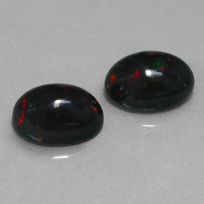 Gemas de ópalo negro multicolor natural de  ct, corte óvalo, opaco