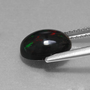 Ópalo negro multicolor natural de 1,27 ct, corte óvalo, opaco