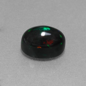 Ópalo negro multicolor natural de 1,38 ct, corte óvalo, opaco