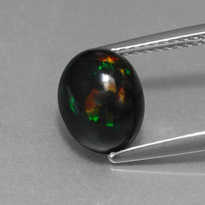Ópalo negro multicolor natural de 1,58 ct, corte óvalo, opaco