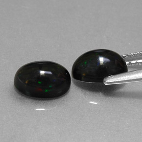 Gemas de ópalo negro multicolor natural de  ct, corte óvalo, opaco