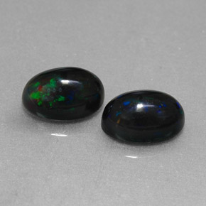 Gemas de ópalo negro multicolor natural de  ct, corte óvalo, opaco