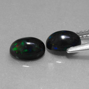 Gemas de ópalo negro multicolor natural de  ct, corte óvalo, opaco