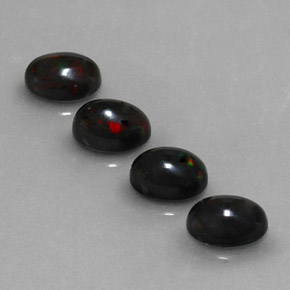 Gemas de ópalo negro multicolor natural de  ct, corte óvalo, opaco