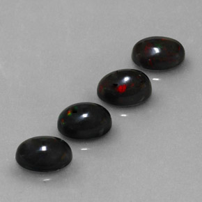 Gemas de ópalo negro multicolor natural de  ct, corte óvalo, opaco