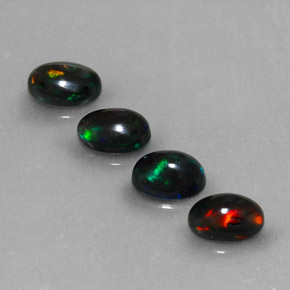 Gemas de ópalo negro multicolor natural de  ct, corte óvalo, opaco