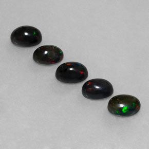 Gemas de ópalo negro multicolor natural de  ct, corte óvalo, opaco