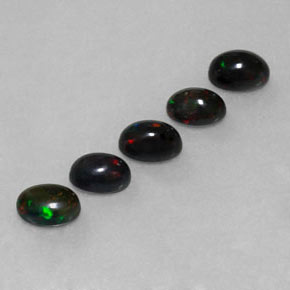Gemas de ópalo negro multicolor natural de  ct, corte óvalo, opaco