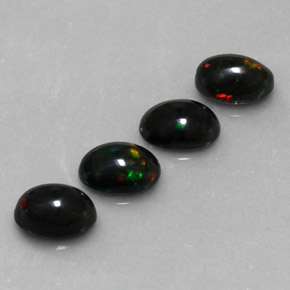 Gemas de ópalo negro multicolor natural de  ct, corte óvalo, opaco